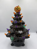 12 inch black ceramic Halloween tree with orange and purple bulbs, spiders, and jack-o'-lantern topper