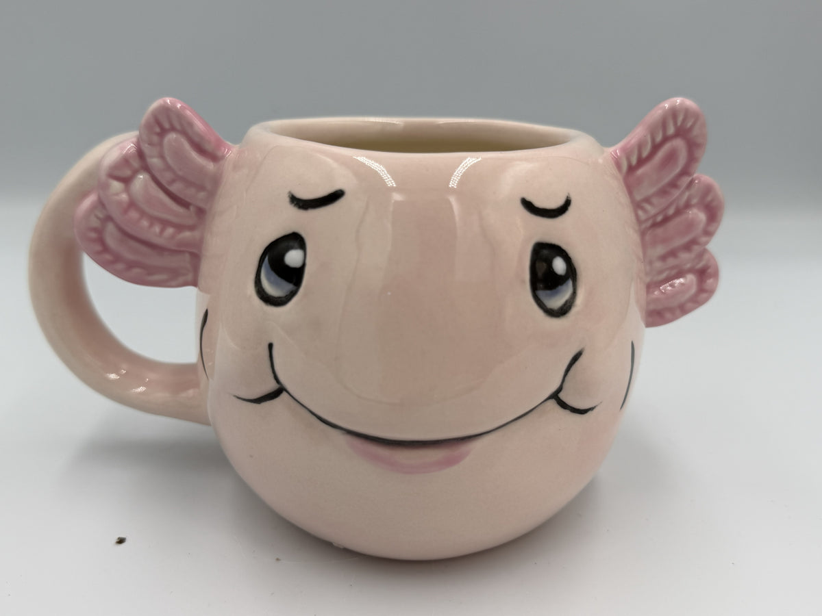 Pink ceramic axolotl mug with sculpted gills and smiling face
