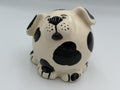 Round cream ceramic dog bank with black spots and floppy spotted ears