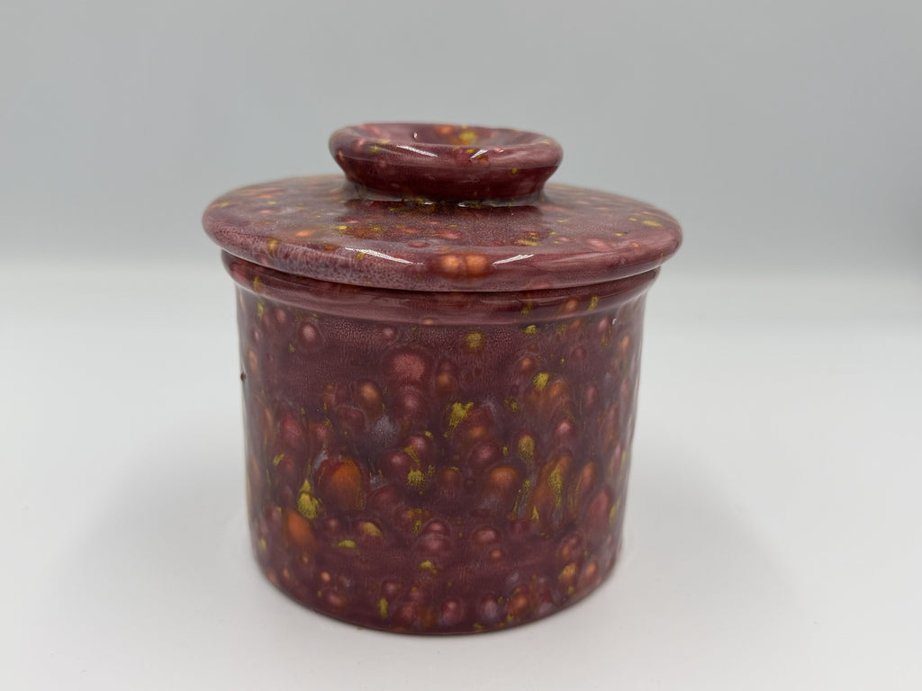 Maroon speckled ceramic butter bell with lid closed