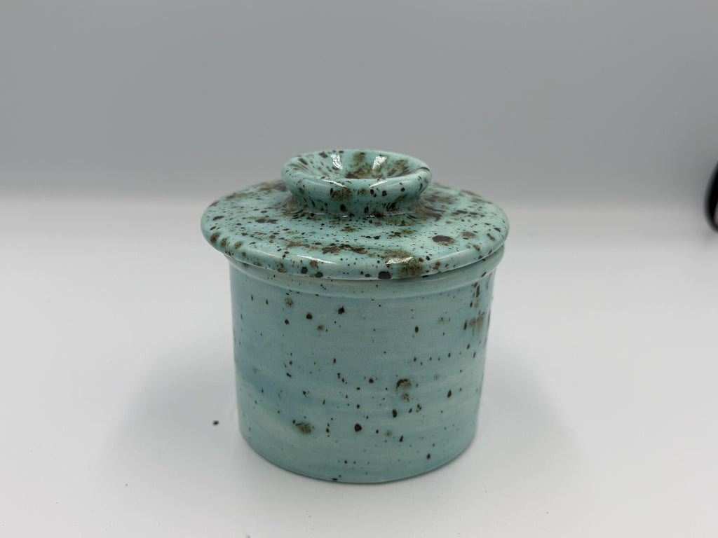 Turquoise speckled ceramic butter bell with lid closed