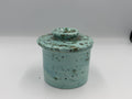 Turquoise speckled ceramic butter bell with lid closed