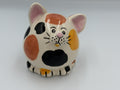 Round cream ceramic calico cat bank with orange, yellow, and black patches and pink ears