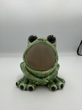 Front view of green ceramic frog scrubby holder with open mouth and big black eyes