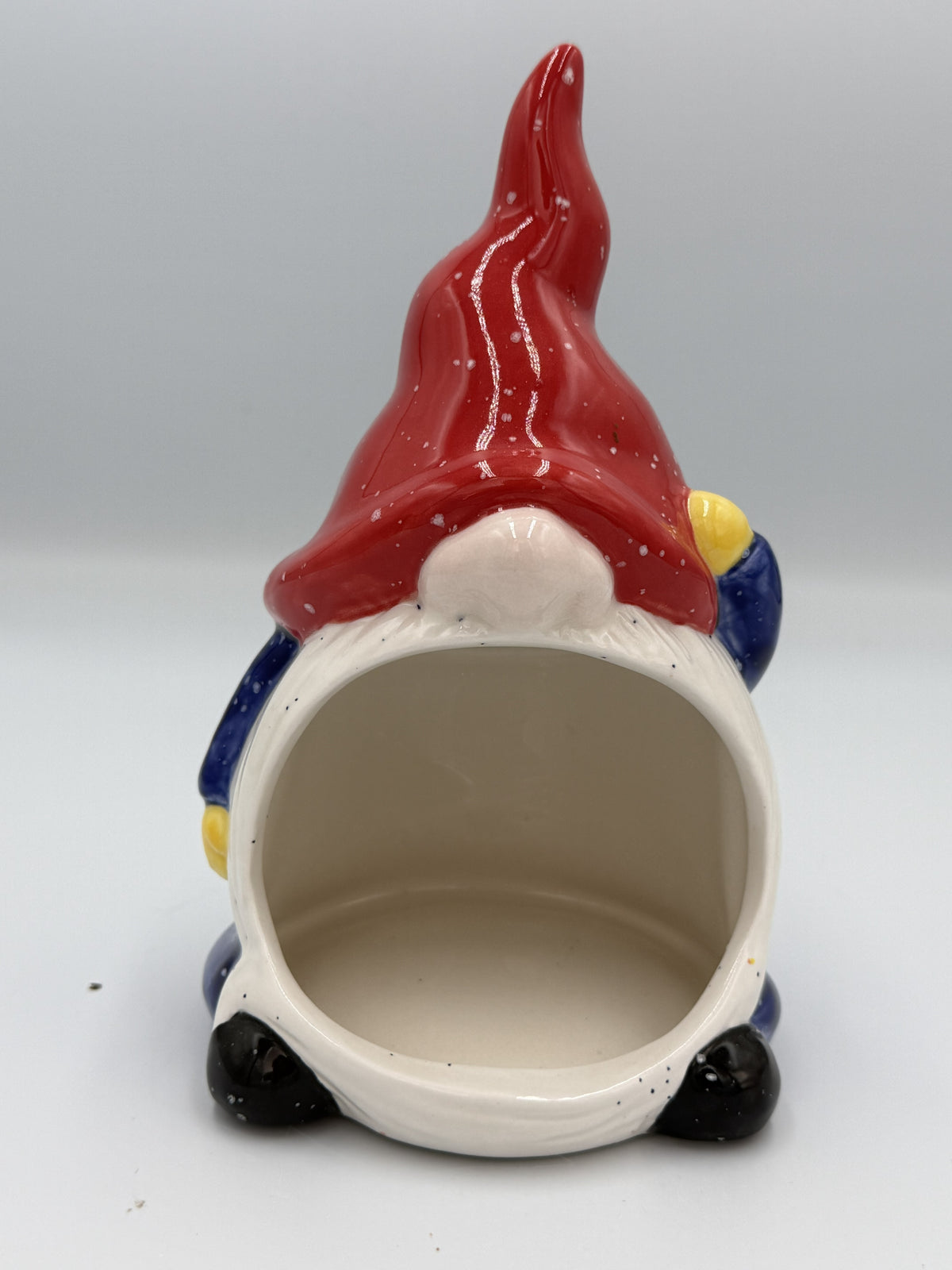 Front view of gnome ceramic scrubby holder with red hat and white beard opening