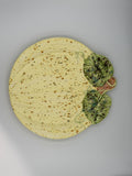 Cream speckled ceramic pumpkin-shaped plate with sculpted green leaves, stem, and vines
