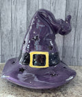 Purple ceramic witch hat lantern with star cutouts and gold buckle